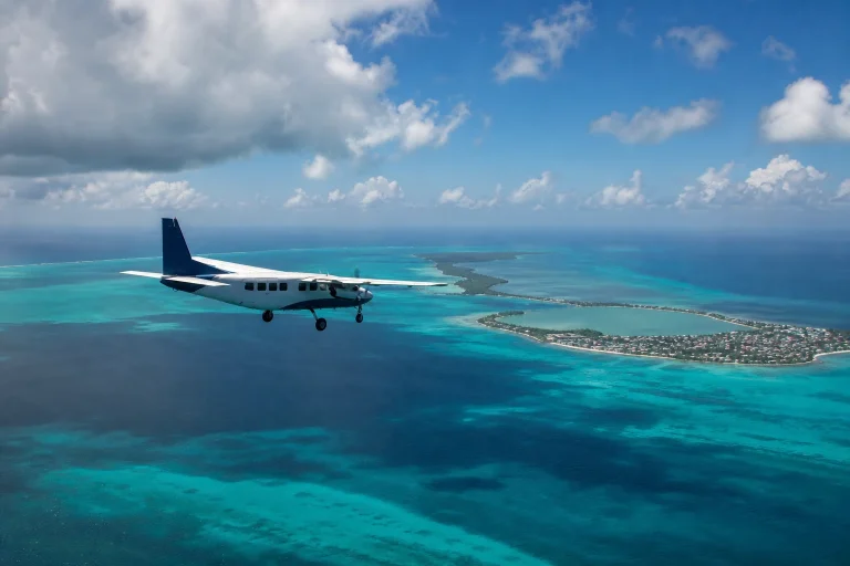 Small passenger aircraft above Caribbean water near San Pedro, Belize