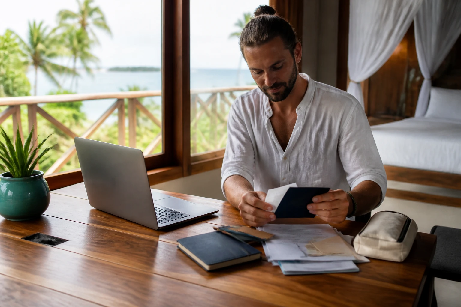 Traveler organizing documents and a laptop before a Belize stay