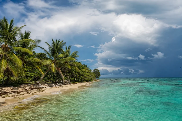 Lush Belize coastline under fall rain clouds