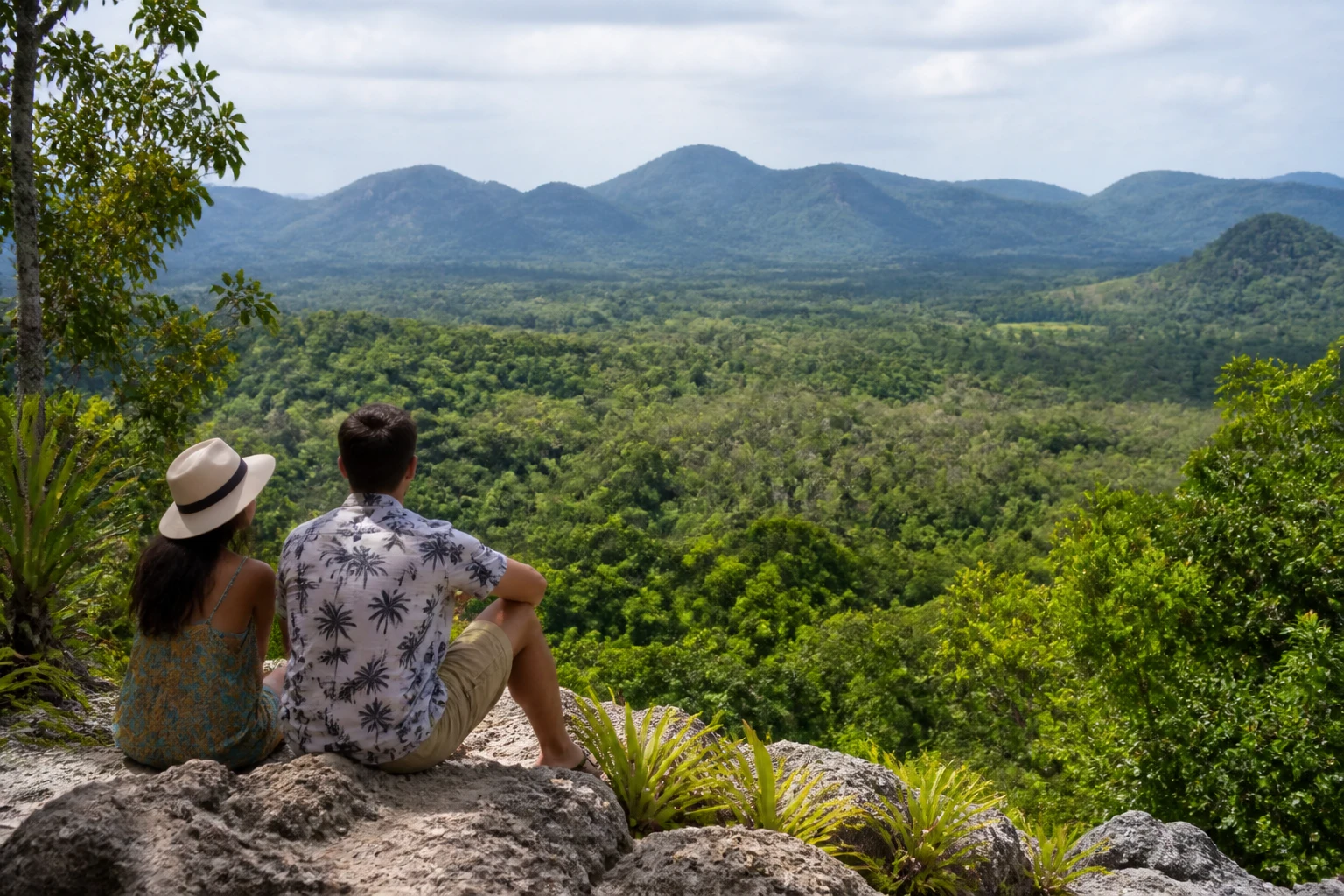 Couple overlooking lush rainforest in Belize