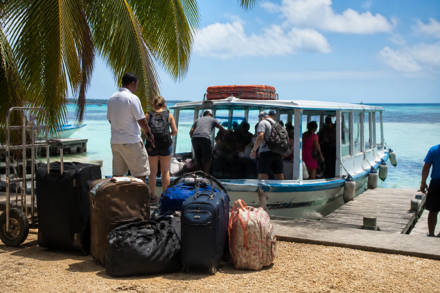 Luggage and passenger boat during a Belize island transfer