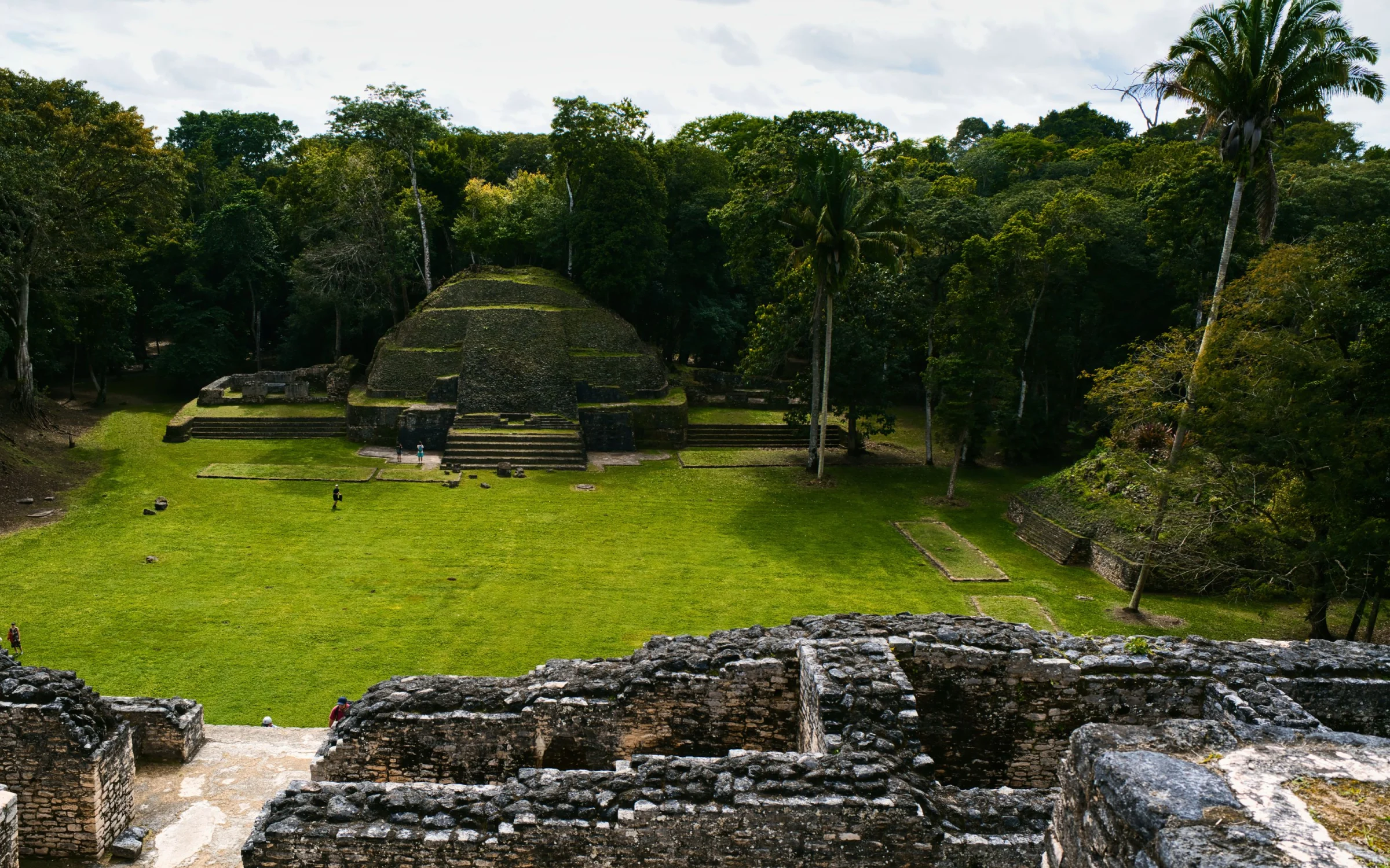 Xunantunich Maya pyramid rising above jungle canopy