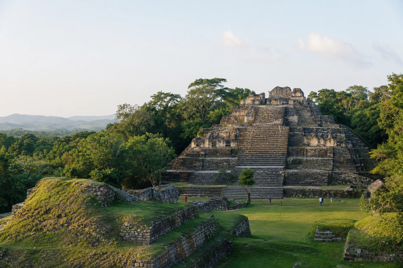 Stone Maya ruins surrounded by tropical greenery in Belize