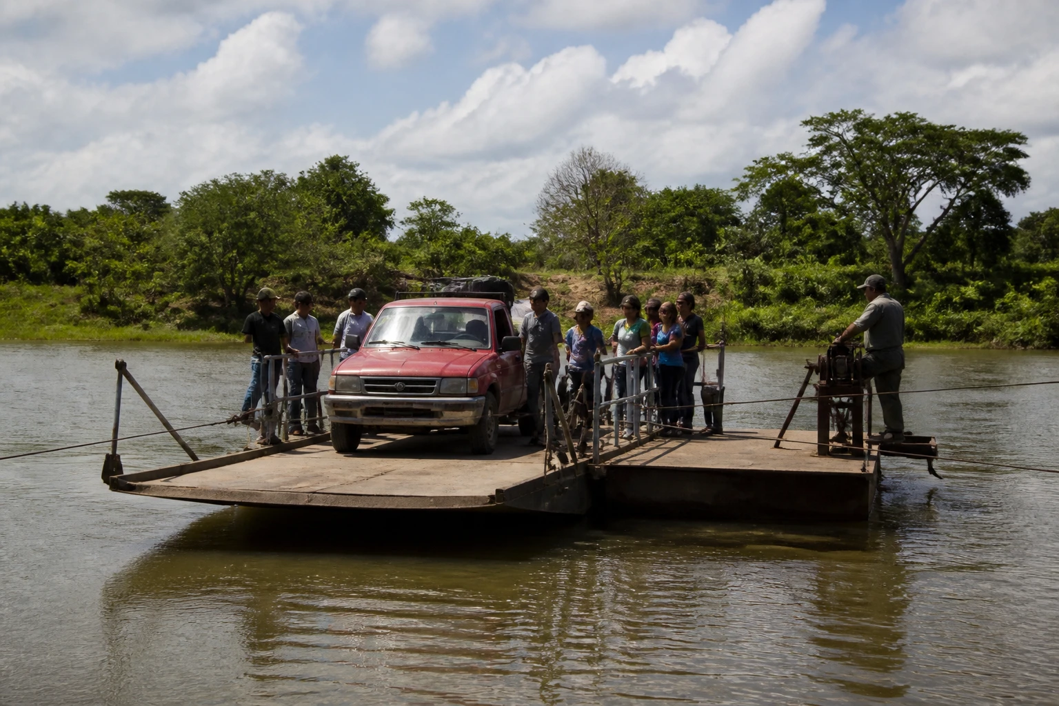 Hand-cranked ferry crossing the Mopan River on the way to Xunantunich